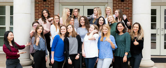 Group photo of Coordinated Program in Dietetics graduates emoting